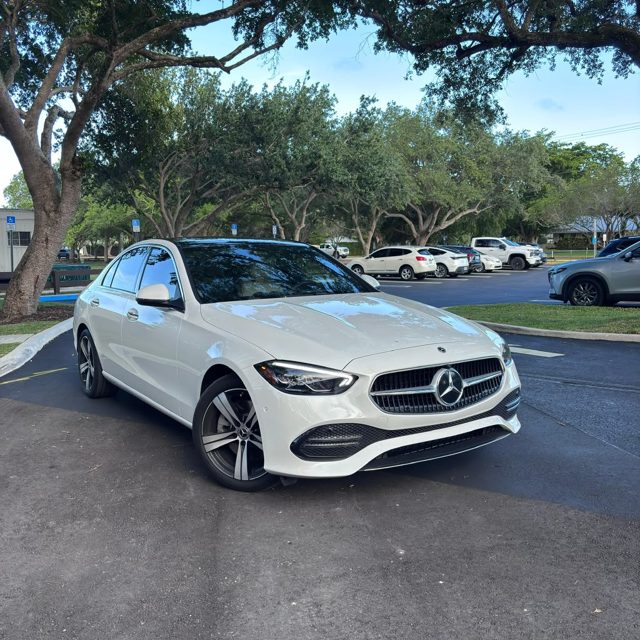 White Mercedes-Benz C300, front three-quarter view