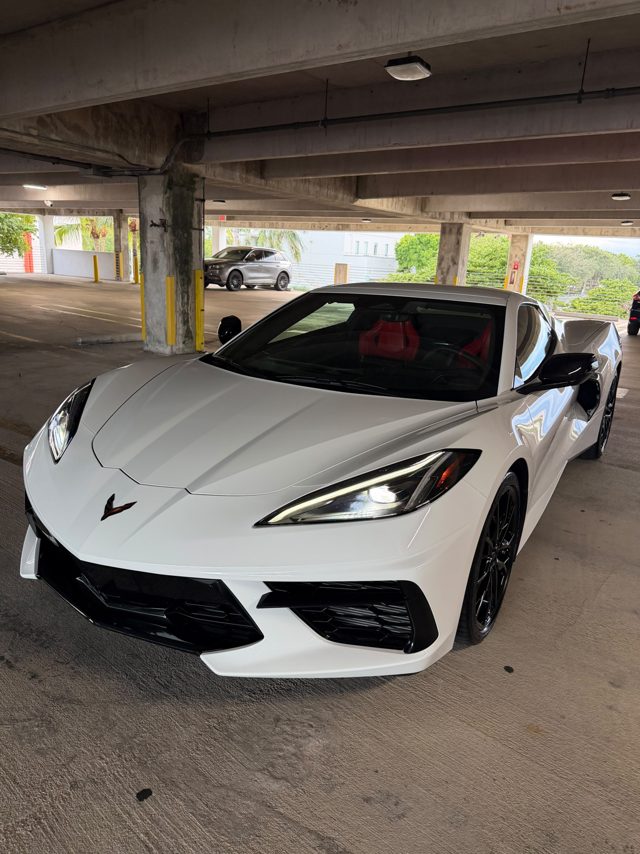 White 2027 Corvette C8 front view with red interior