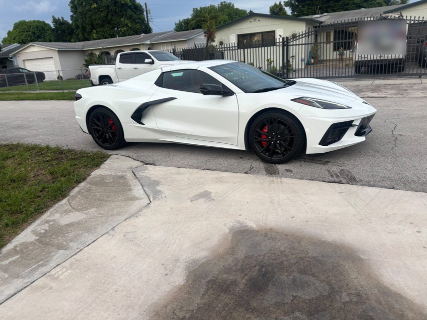 White 2027 Corvette C8 side profile with red calipers