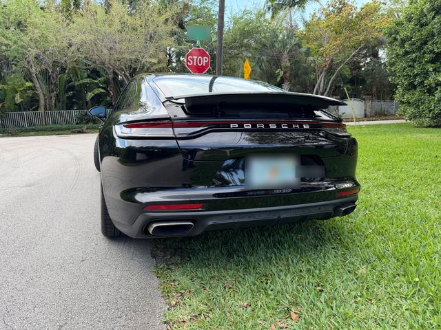Black Porsche Panamera from the rear, spoiler up