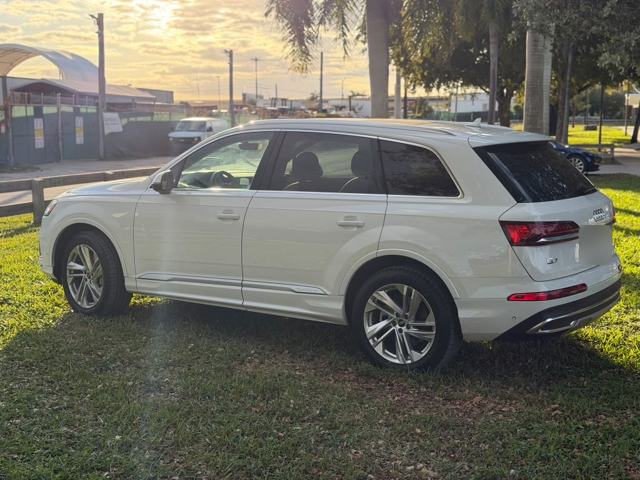 White Audi Q7 at sunset, rear three-quarter view