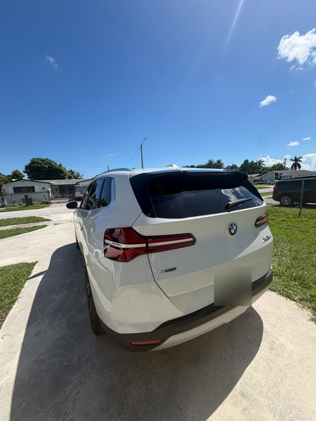 White BMW X3 xDrive, rear three-quarter view