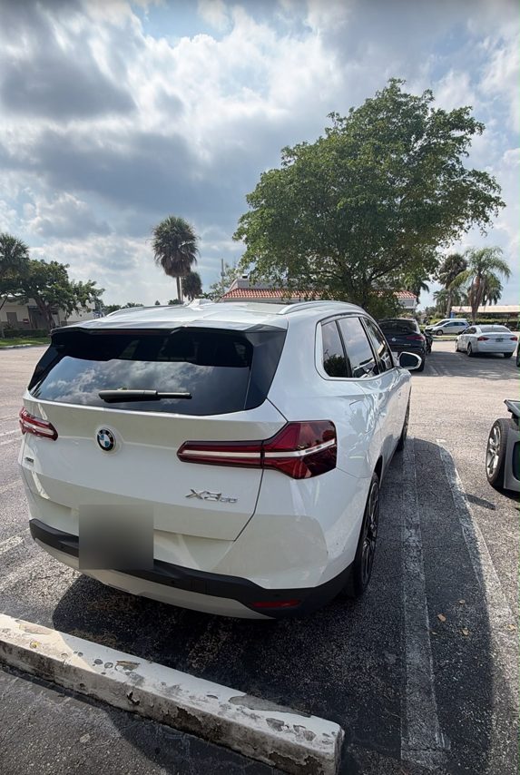 White BMW X3, rear view